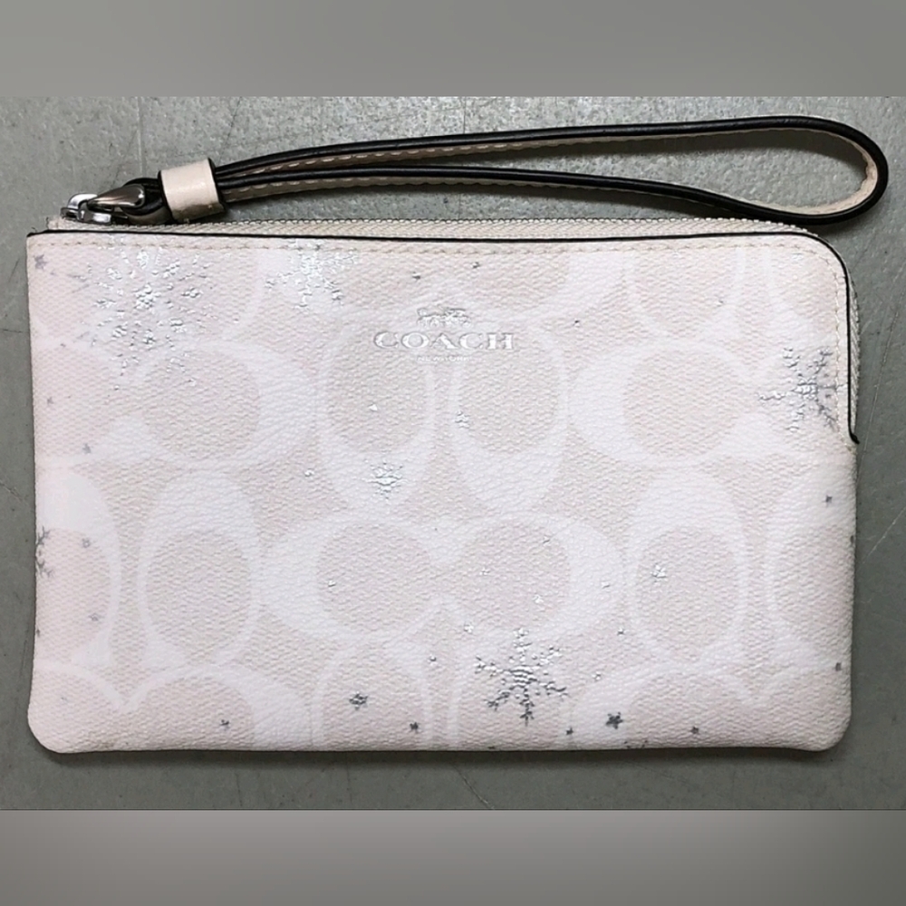Coach Snowflakes white Wristlet.